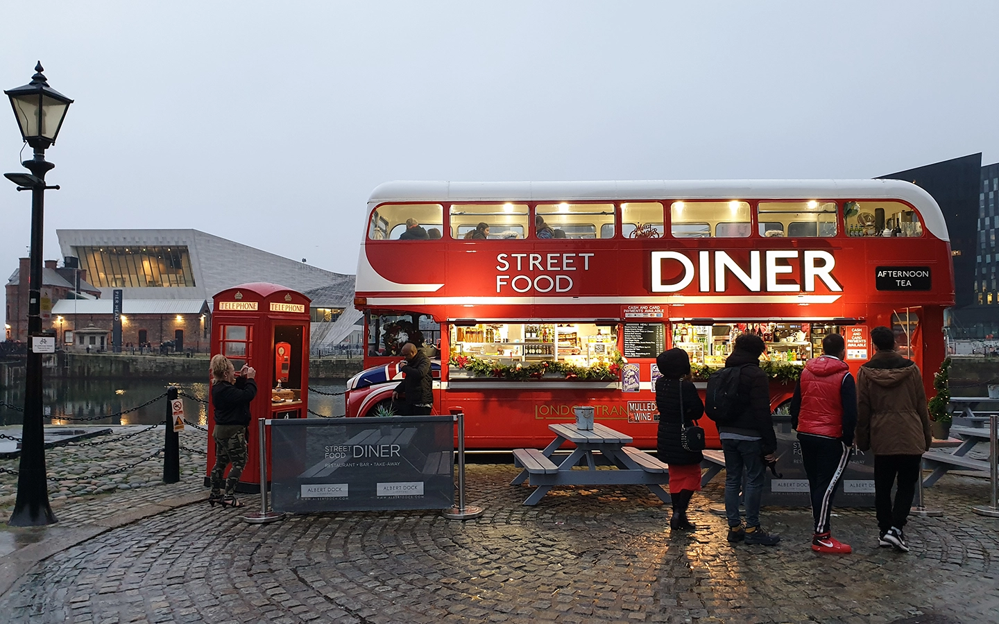 Hero image of food truck selling fast food on the street.