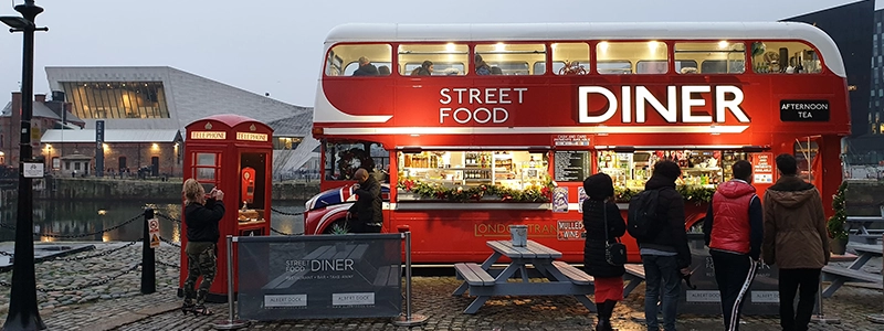 Flysoft POS machine and cashdrawer are showcased in front of a food truck.